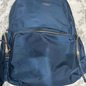 Navy blue and gold tumi backpack nylon